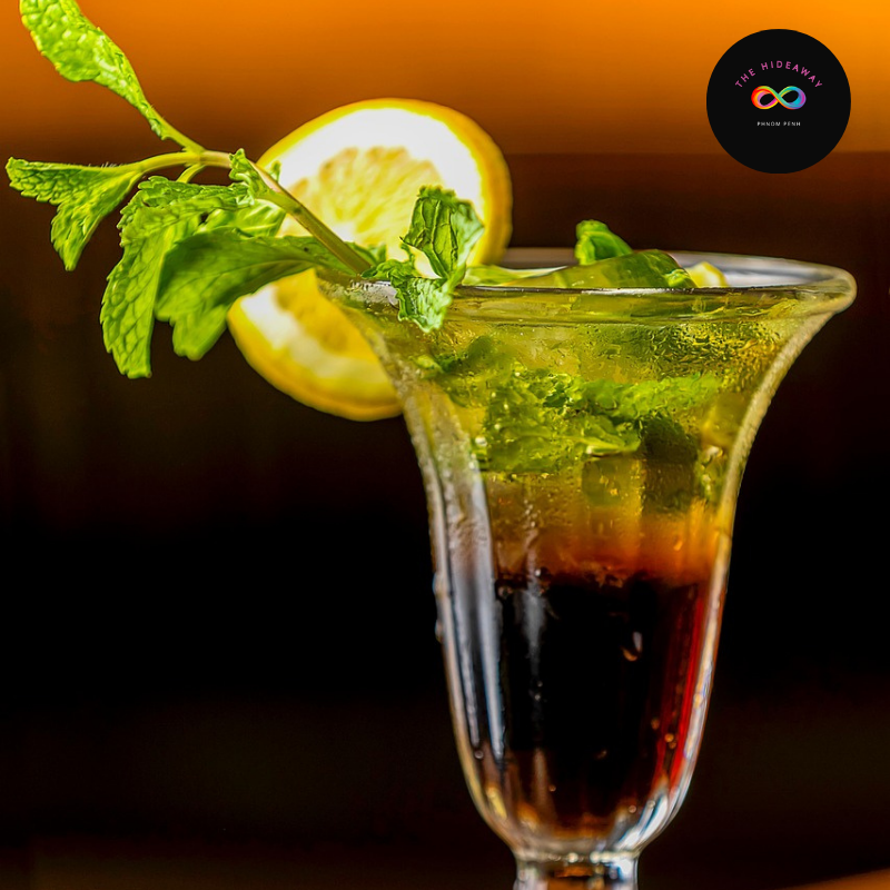 The Heritage Pour A beautifully presented The Stonewall Sling cocktail at a premier LGBTQ+ bar in Cambodia