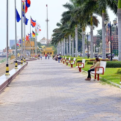 main promenade in Phnom penh with cambodain flags