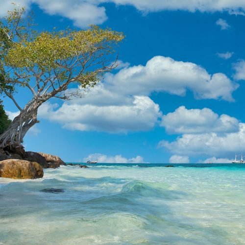 unnamed asian beech with sunshine and blue seas