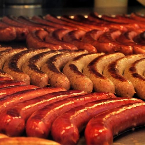 happy hour sausages on a BBQ